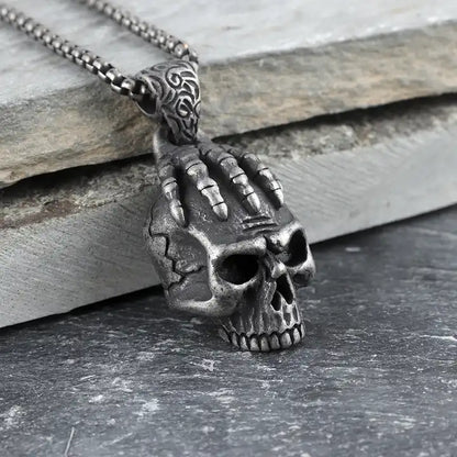 hands skeleton holding head skull Necklace